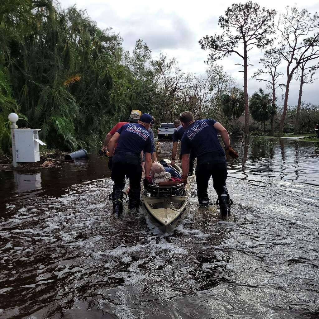 Firemen save J. after Hurricane Ian