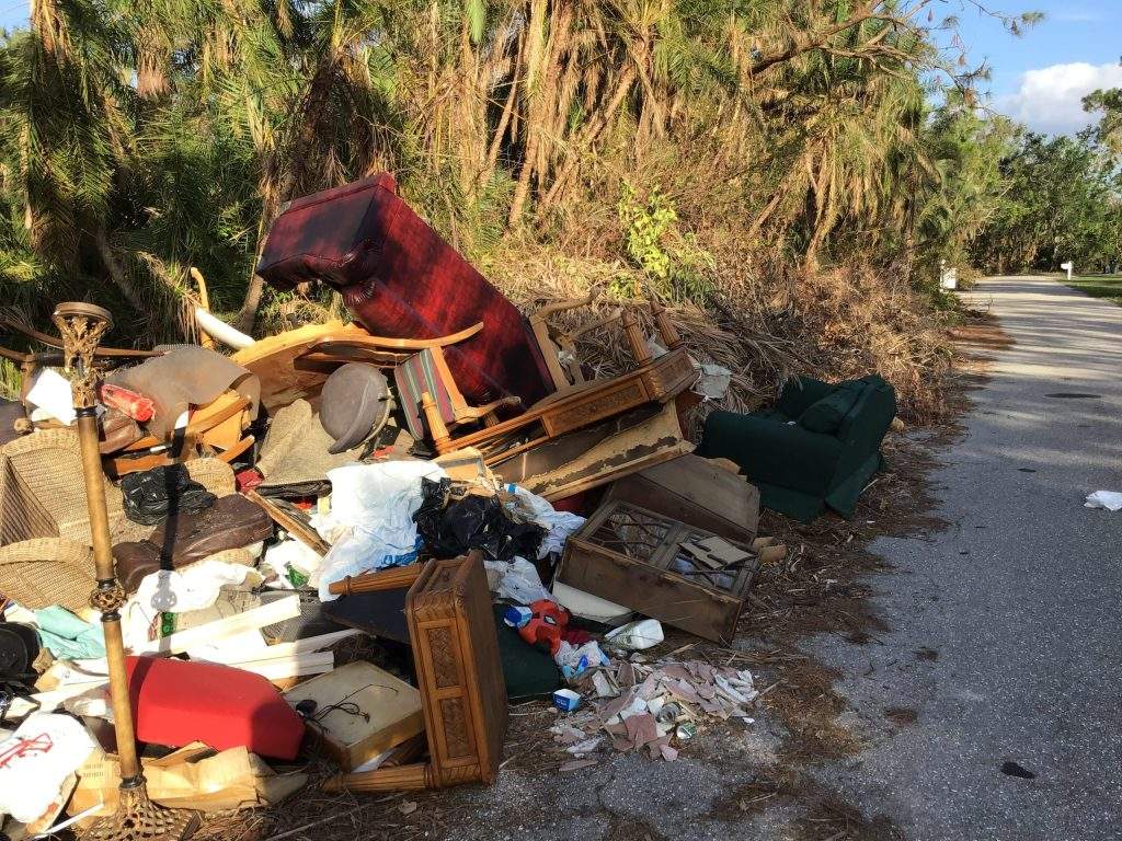 Discarded Furniture, equipment, trash, & debris, for the
"CLAW," John's House, Hurricane Ian